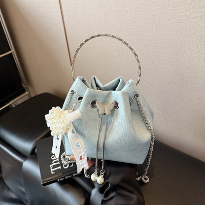 Stylische Handtasche mit Schmetterlingsdetail Brehn