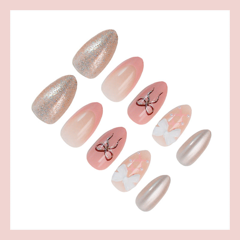 Kunstnagelset mit romantischen Schleifen- und Blumenverzierungen Brehn