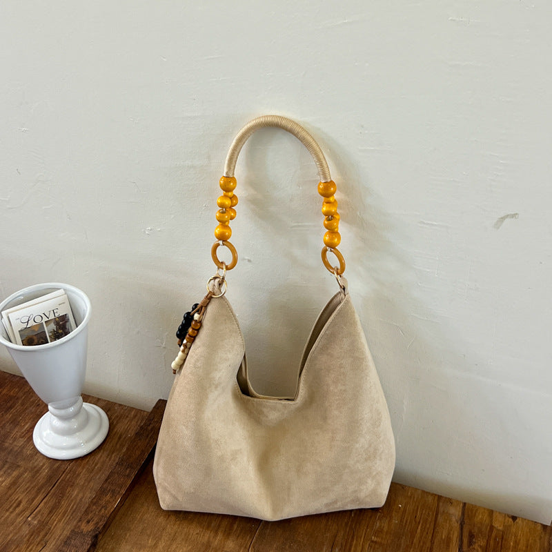 Stylische Hobo-Handtasche mit Perlenriemen