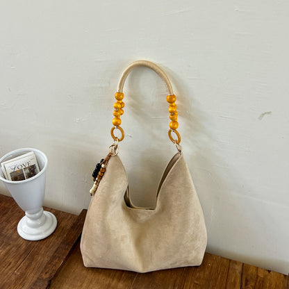 Stylische Hobo-Handtasche mit Perlenriemen