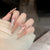 Elegante Stiletto Press-On Nagelkunst mit Strassakzenten Brehn