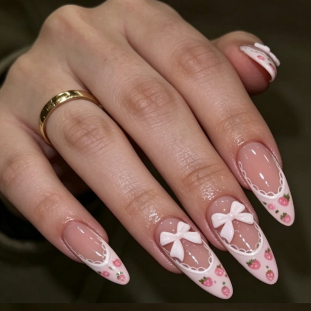 Elegante Stiletto Press-On Nägel mit floralem und Schleifenakzenten Brehn