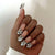 Exquisite Nagelkunst mit Schmuckelementen Brehn