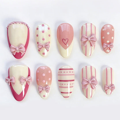 Kunstnagelset mit romantischen Schleifen- und Herzenmotiven Brehn