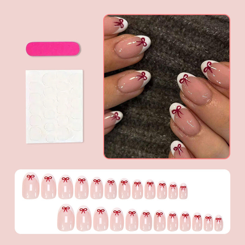 Kunstnagelset mit romantischen Schleifen-Motiven und französischem Design Brehn