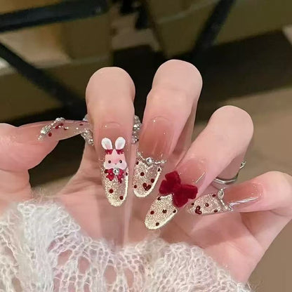 Künstlerische Stiletto Press-On Nagelkunst mit schimmernden Akzenten Brehn