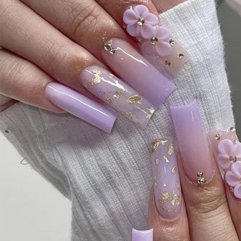 Kunstvolle Gel-Nägel mit Floral-Design und Glitzerakzenten Brehn