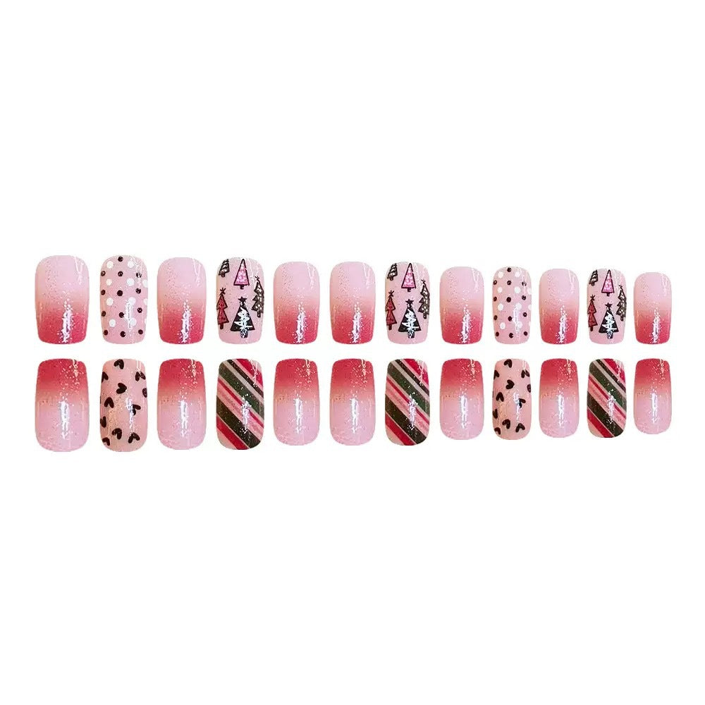 Kunstnagelset mit festlichen Weihnachtsmotiven und funkelnden Akzenten Brehn