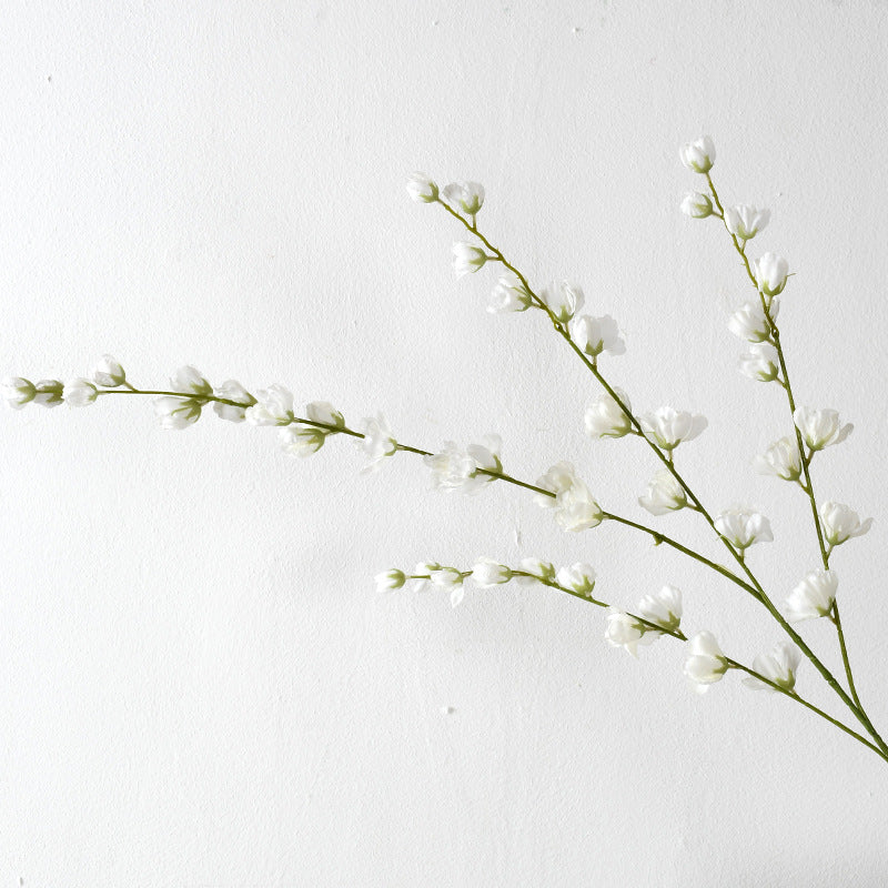 Dekorative florale Erbsenblütenstielanordnung