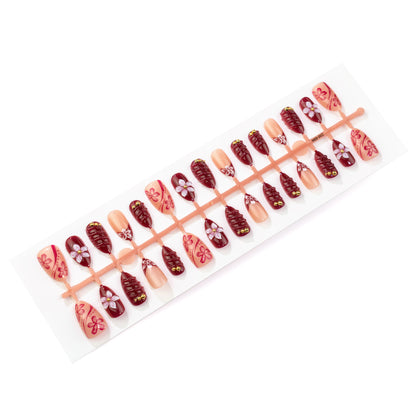 Künstlerisches Press-On Nagelkunst Set mit blumigen und glänzenden Designs Brehn