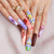 Kreatives Kunstnagelset mit elegantem Floral-Design und Glitzerakzenten Brehn