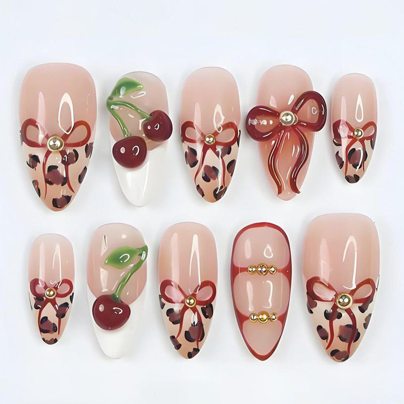 Kunstnagelset mit kreativen Schleifen- und Fruchtdesigns Brehn