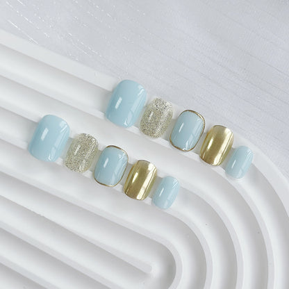 Künstlerisches Press-On-Nagelset mit Glitzer und metallischen Akzenten
