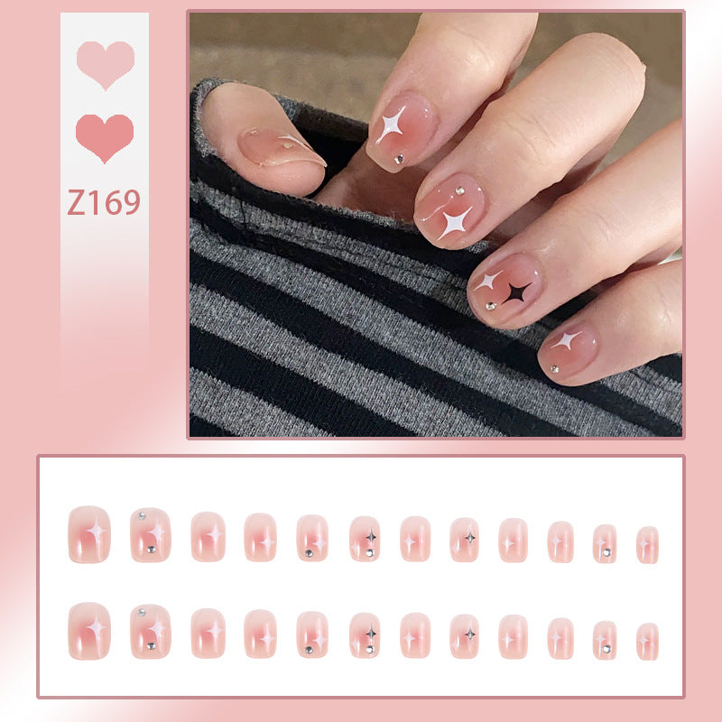 Kunstnagelset mit funkelnden Sternenverzierungen und eleganten Akzenten Brehn