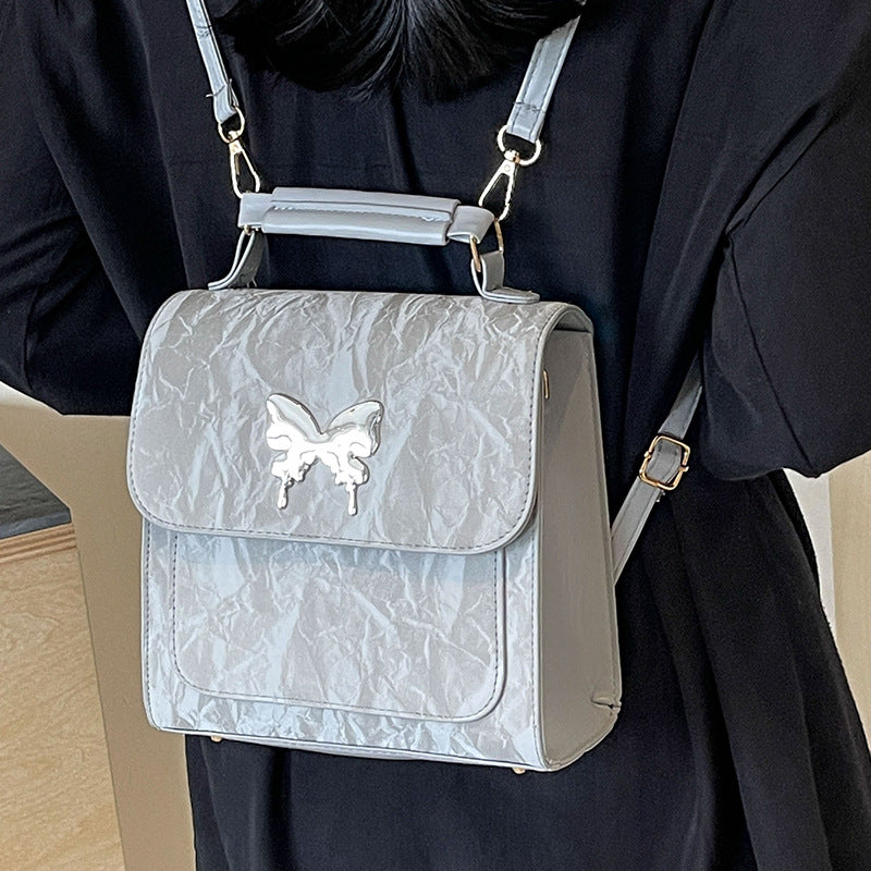 Schmetterlingsverzierte Handtasche