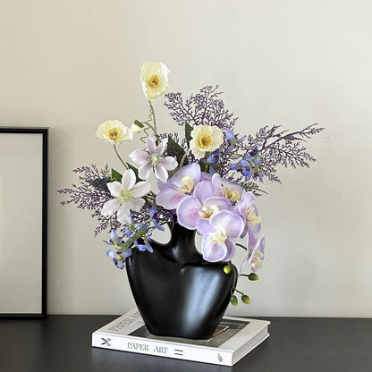 Lebensechte dekorative Blumengesteck