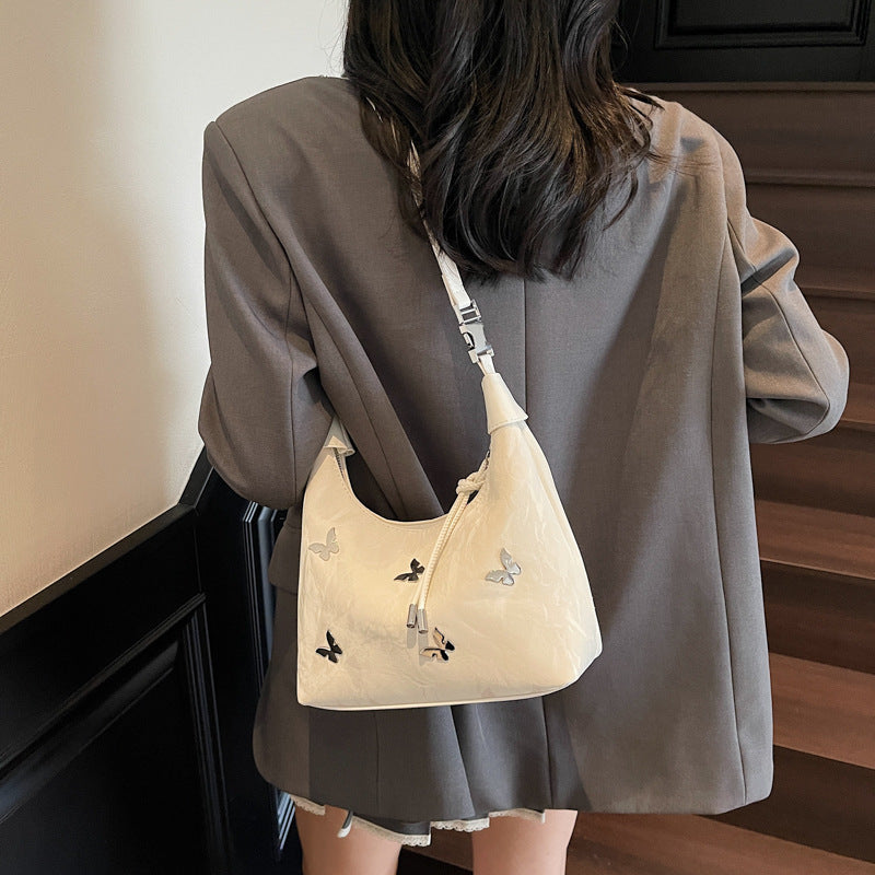 Stylische Handtasche mit Schmetterlingsdetail Brehn
