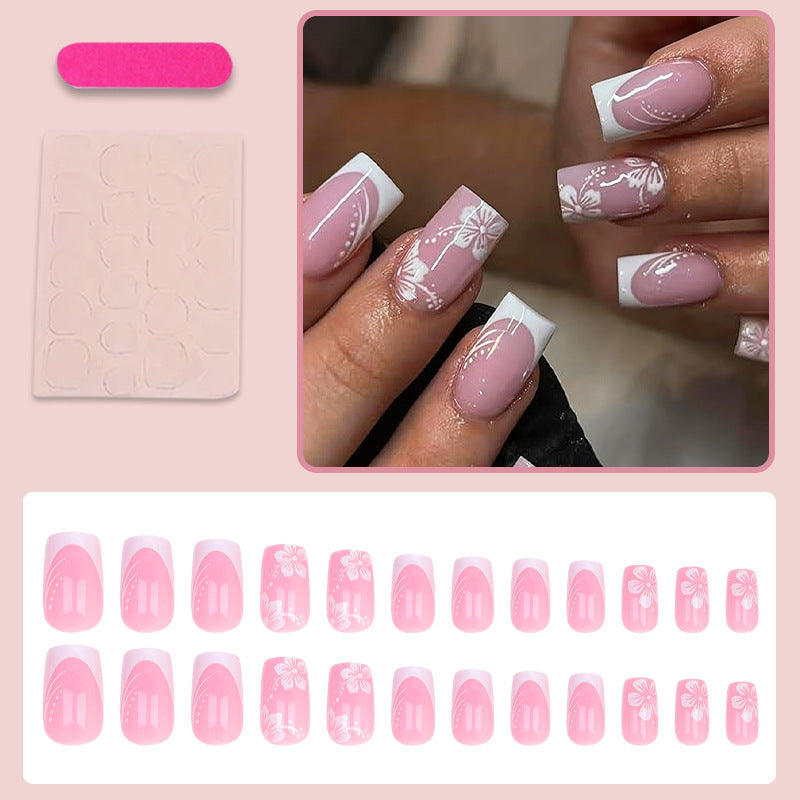 Kunstnagelset mit elegantem französischen Design und zarten Blütenmustern Brehn