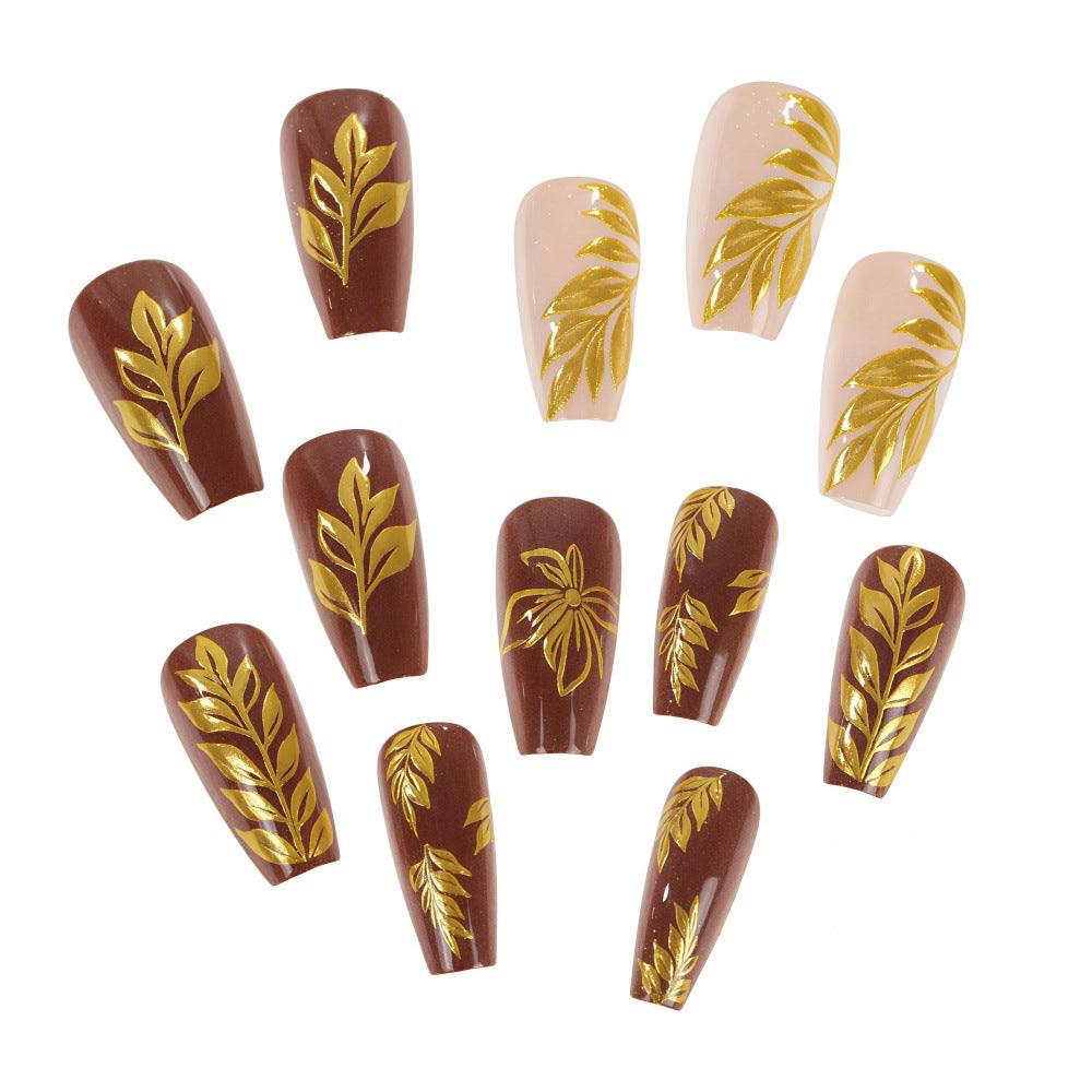 Kunstnägel mit floralem Gold-Design Brehn
