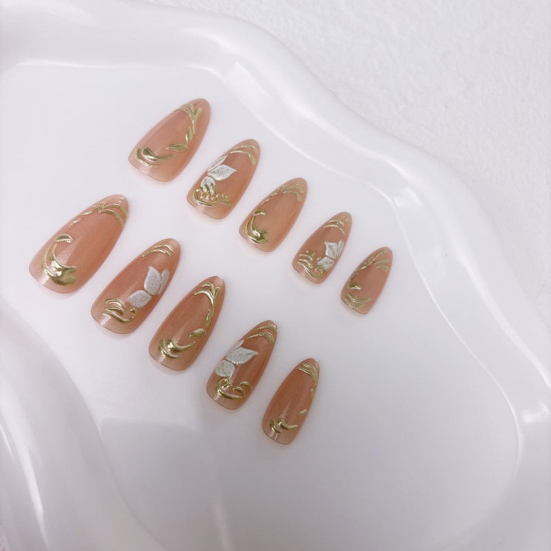 Elegante Kunstnägel mit Marmor- und Goldakzenten Brehn