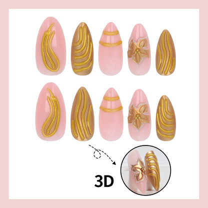 Kunstnagelset mit goldenen Verzierungen und eleganten Formen Brehn