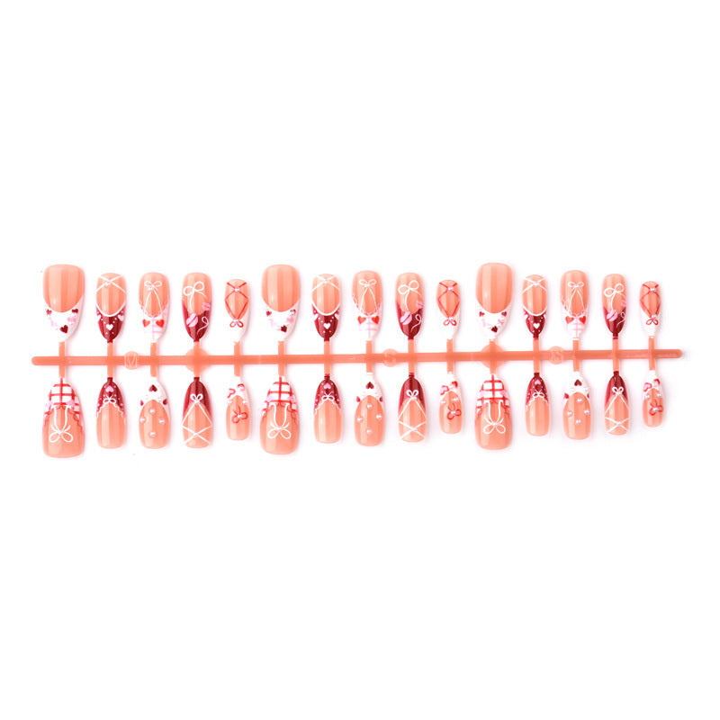 Dekoratives Presse-On Nagelkunstset mit Schleifen- und Herzen-Designs Brehn