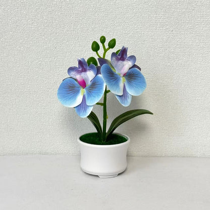 Elegante künstliche Orchideenpflanzenanordnung für die Innendekoration