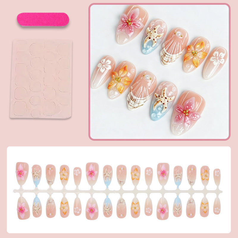 Kunstnagelset mit floralen Motiven und strahlenden Akzenten Brehn