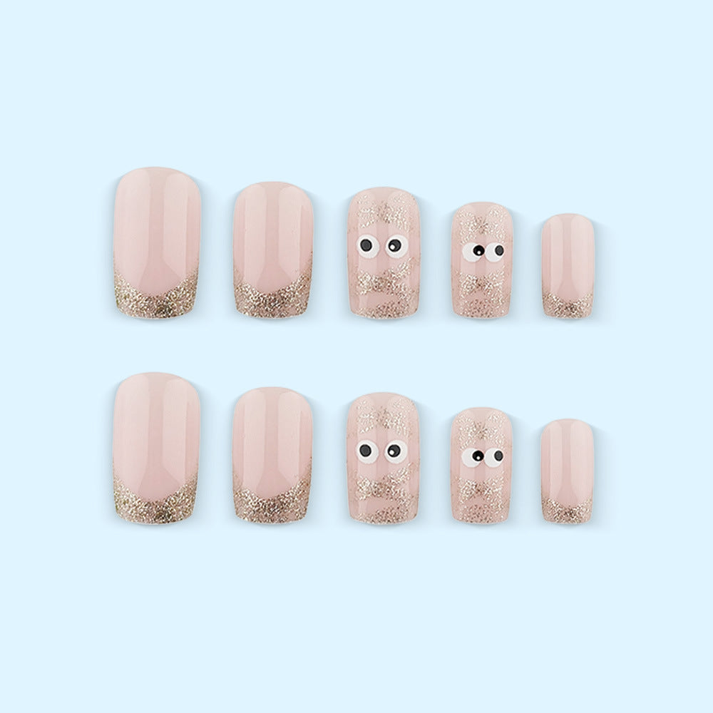 Kunstnägel mit verspielten Augen-Design und Glitzerspitzen Brehn