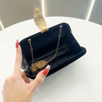 Elegante abendhandtas mit Blattakzenten