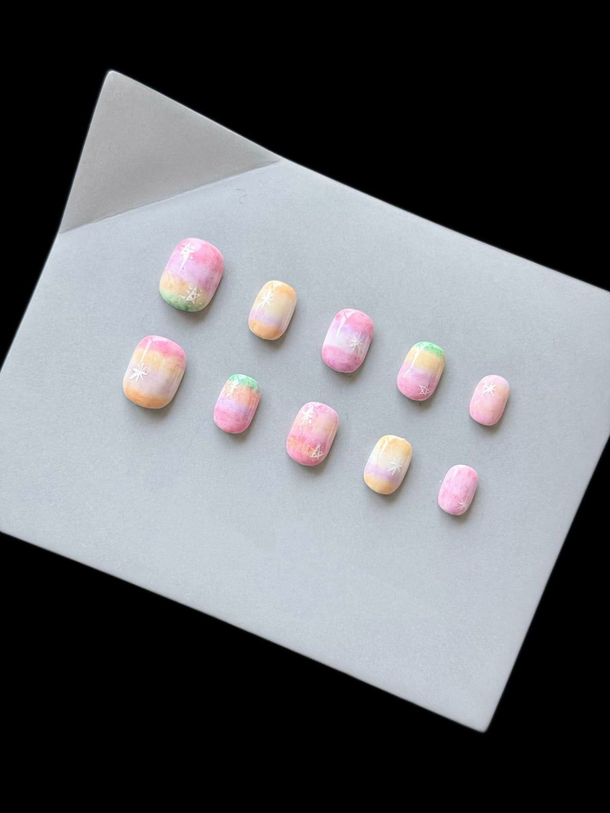 Künstlerisches Press-On Nagelset mit Ombre- und Sternendesign