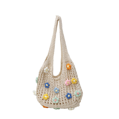 Blumenverziertes gehäkeltes Tote