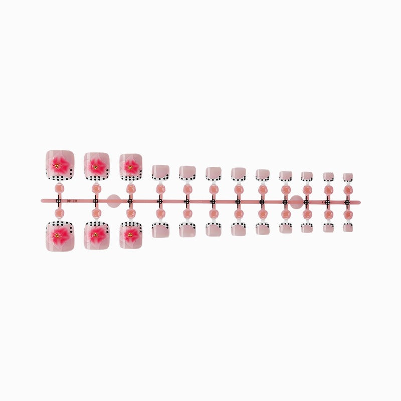 Kunstnagelset mit eleganten Blüten- und Punkte-Design Brehn