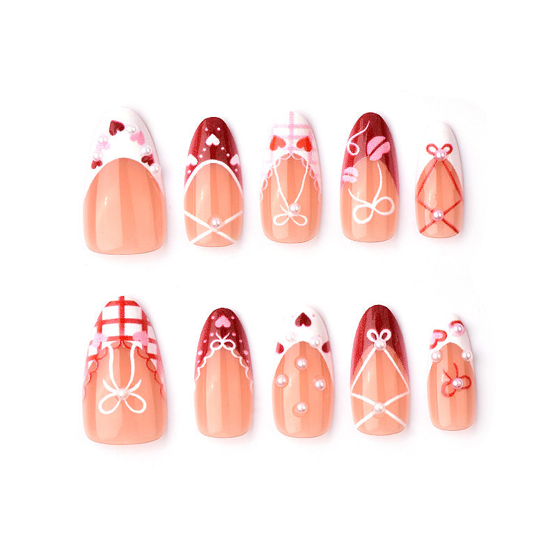 Dekoratives Presse-On Nagelkunstset mit Schleifen- und Herzen-Designs Brehn