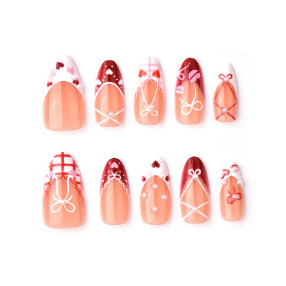Dekoratives Presse-On Nagelkunstset mit Schleifen- und Herzen-Designs Brehn