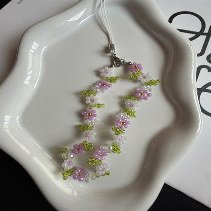 Perlenbesetzte Blumenschmuckkette Brehn