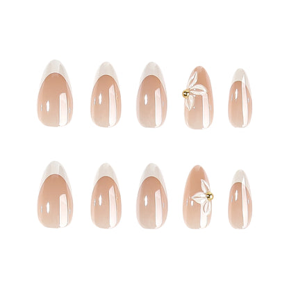 Kunstvolle Stiletto-Nägel mit elegantem Blumendesign Brehn