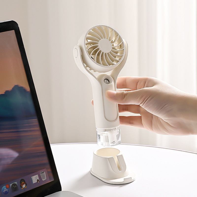 Unisex nan tragbarer Handventilator mit neigbarem Kopf, faltbarem Standfuß und USB-Ladestation Brehn