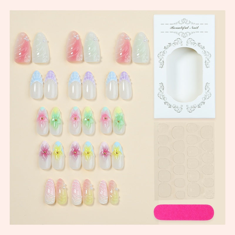Kunstnagelset mit bunten floralem Design und Glitzerakzenten Brehn
