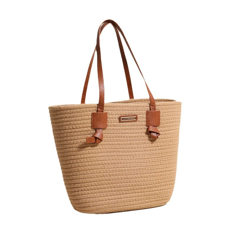 Damen Handtasche aus strukturiertem Naturmaterial mit braunen Lederriemen Brehn