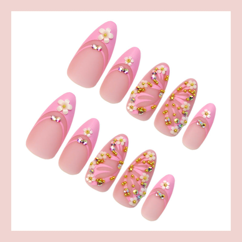 Kunstnagelset mit eleganten Blüten- und Glitzerverzierungen Brehn