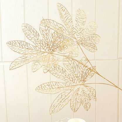 Dekoratives Goldenes Münz-Zweig Arrangement