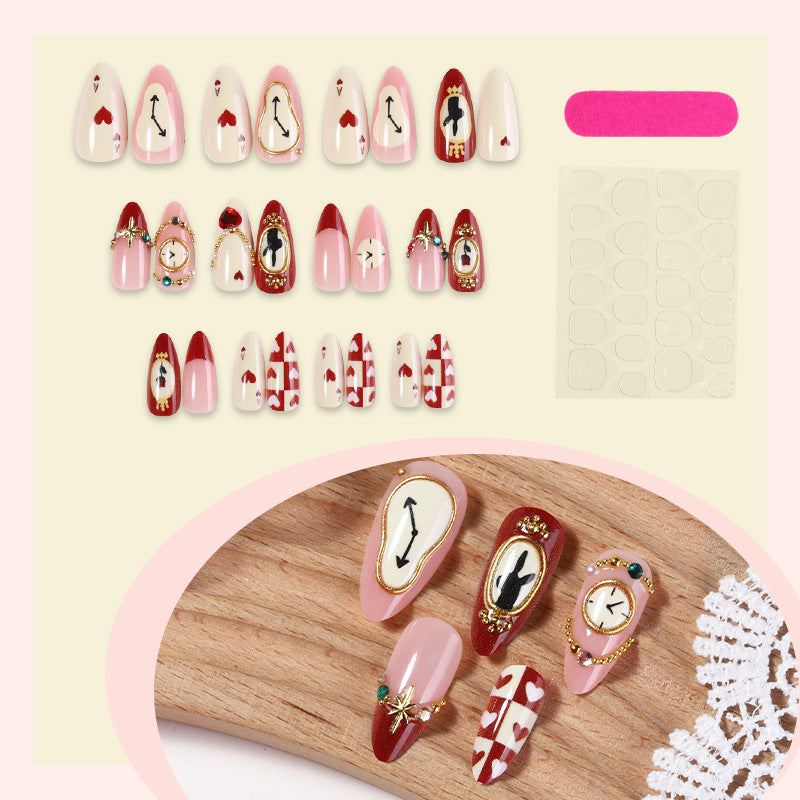 Künstlerisches Press-On-Nagelset mit kreativen Herz- und Uhrendesigns Brehn