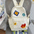Blumenbestickter Schulrucksack