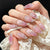 Kunstnagelset mit elegantem Blumendesign und Glitzernoten Brehn