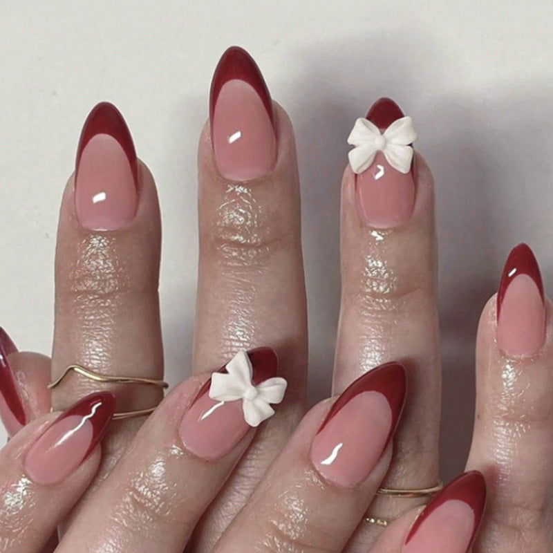 Kunstnagelset mit elegantem Spitzen-Design und romantischen Schleifen Brehn
