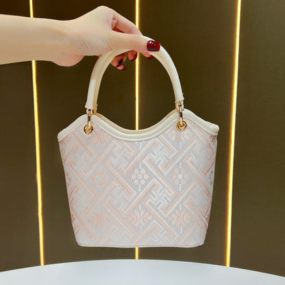 Dekorative gemusterte Handtasche