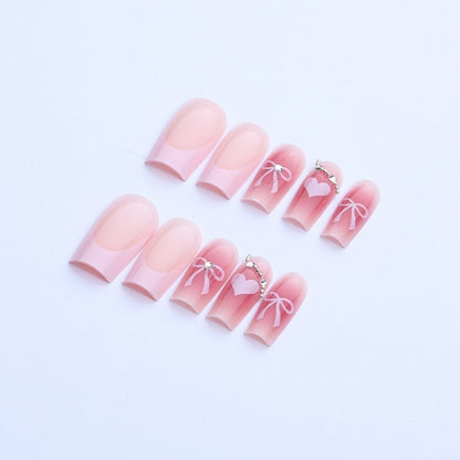 Kunstnagelset mit eleganten Schleifen- und Glitzermotiven Brehn