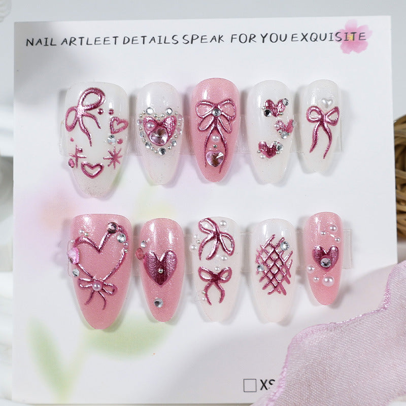 Kunstnagelset mit romantischen Schleifen- und Herzdesigns Brehn