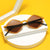 Damen stylische geometrische Sonnenbrille mit elegantem Rahmen Brehn